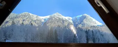 a view of a snow covered mountain from a window at Villa Molteni, Ville di Fiemme, Varena in Varena