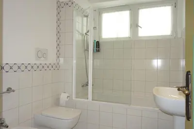 a bathroom with a toilet and a sink and a shower at Villa Molteni, Ville di Fiemme, Varena in Varena