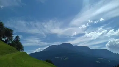 a view of a mountain under a cloudy sky at Unterweg Hof in Sarntal