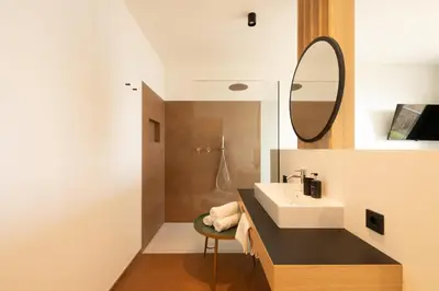 a bathroom with a sink and a mirror at San Antonia in Caldaro