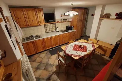 an overhead view of a kitchen with a table and chairs at Maso Brunetto in Canale San Bovo