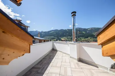 a view from the balcony of a house with wooden walls at CASA PARE' B&B in Tesero