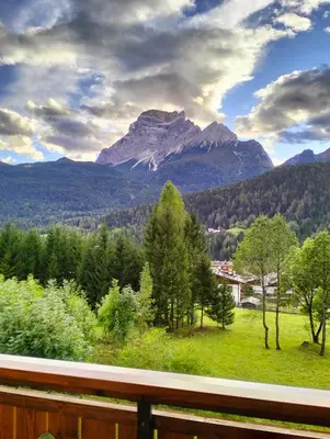 a balcony with a view of a mountain at Deliziosa mansarda con vista Dolomiti in San Vito di Cadore