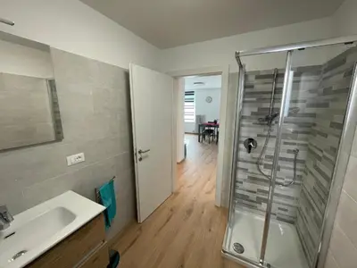 a bathroom with a shower and a sink at Apartment LUNA in Tesero