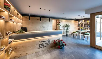 a lobby of a hotel with a reception desk at Hoferhof in Maranza