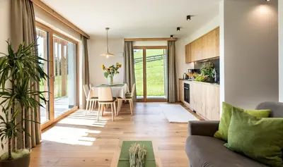 a backpack and a bed with a pillow and a backpack at Hoferhof in Maranza