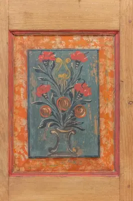 a painting of a plant with red flowers on a wall at DolomiApartments - Appartamenti Campanil 1 e Campanil 2 in Predazzo