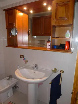 a bathroom with a sink and a toilet at Maison al Lago in Alleghe