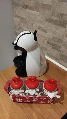 a penguin mixer sitting on top of a table at In centro col giardino in Predazzo