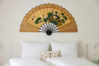a picture of a basket on a wall above a bed at Italyescapes Emma 22 in Merano