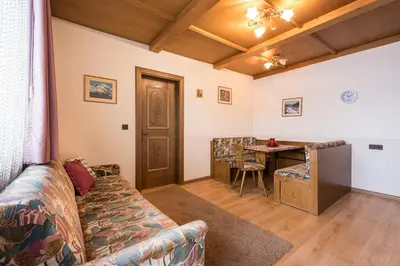 a living room with a couch and a table at Gästehaus Marianne Terenten in Terento
