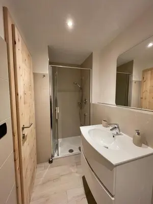 a bathroom with a sink and a shower at Neuhäusl-Hof in San Genesio Atesino