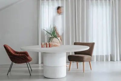 a white table with chairs and a plant on it at chez mone&harry in Lagundo
