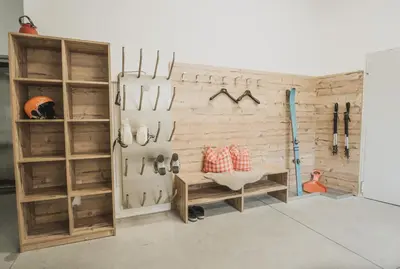 a room with a wall filled with lots of tools at Ragitt Stodl Ferienwohnungen in Vols am Schlern
