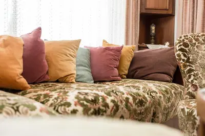 a couch with pillows on it in a living room at Apartment Sybille in Merano