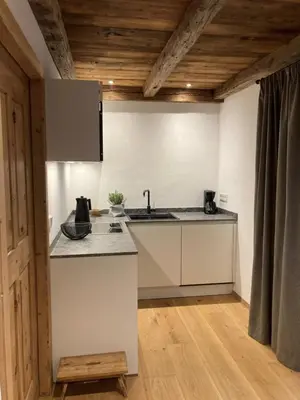 a kitchen with a sink and a counter top at Landhaus Breitenberg in Lana