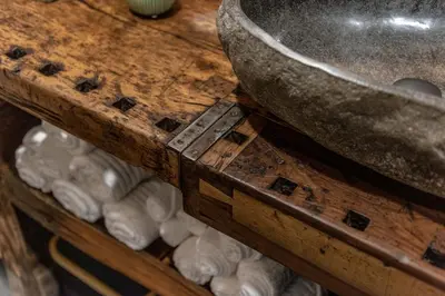 a wooden shelf with a bowl on top of it at Chalet Laugenblick Alpine Luxury with Hot Tub and Sauna in Santa Valburga St. Walburg