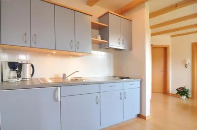 a small room with a bed and a table at Spiegelhof in Appiano sulla Strada del Vino