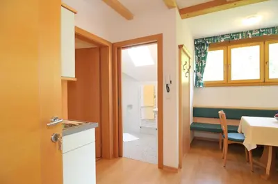 a bedroom with two beds and a painting on the wall at Spiegelhof in Appiano sulla Strada del Vino