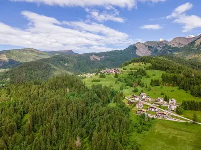 an aerial view of a village in the mountains at Casa Fagher in Canale dʼAgordo