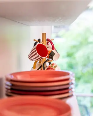 a stack of plates sitting on top of a table at Italyescapes Delia in Merano