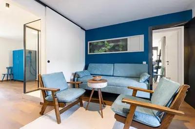 a living room with a couch and two chairs at Michlhaus nature and suites in Aldino