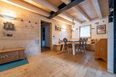 a dining room with a table and chairs at Ciasa Marta in Vigo di Fassa