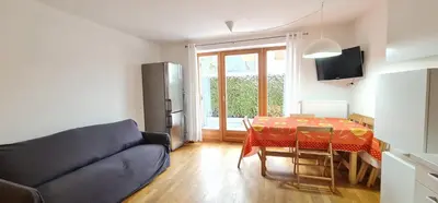 a living room with a couch and a table at Casa dei sogni in Valdaora