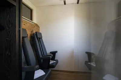 a bathroom with a row of toilet seats at Apartsuites Rosengarten in Lagundo