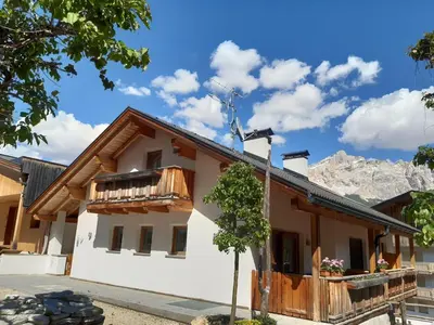 a house in the mountains with a street light at Raisc - La tua casa in Val Badia in La Villa