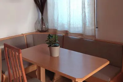 a wooden table with a potted plant on top of it at RÖCK Weingut - winery in Villandro