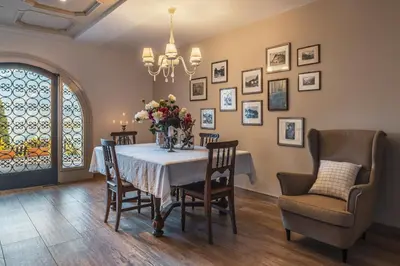 a dining room with a table and chairs at Charming Suite by Dornsberg Panoramic Apartments in Schenna