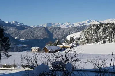 a house in the middle of a snow covered mountain at Chalet am Waldrand in Verano