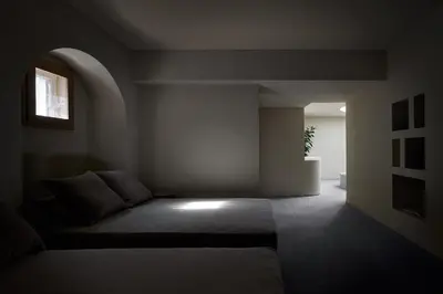 a bedroom with a bed and a window at fink Restaurant & Suites in Brixen