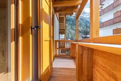 an open door to the balcony of a house at Casa Mari in Falcade