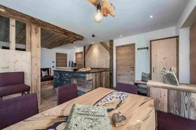 a bedroom with a bed and some wooden walls at Hinterscholerhof in Lazfons