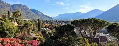 a view of a city with mountains in the background at La Libella - Suite #5 - la terrazza mit privatem Pool in Merano
