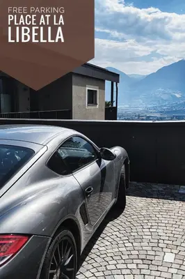 a silver car parked in a parking place at la libilia at La Libella - Suite #5 - la terrazza mit privatem Pool in Merano