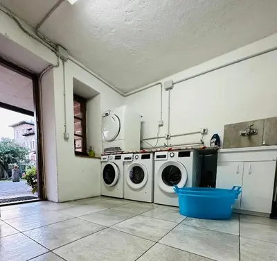 a laundry room with two washing machines in it at Dolomitihouse NOGHERA in Fiera di Primiero