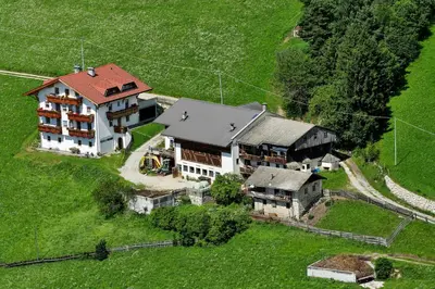 an aerial view of a large house in a field at Parleitnerhof Ferienwohnung Morgenrot in Mühlbach