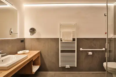a bathroom with a sink and a shower at Natur Residence Kaiser Hans in Schenna