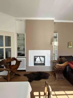 a living room with a couch and a fireplace at Laurelia Suites in Merano