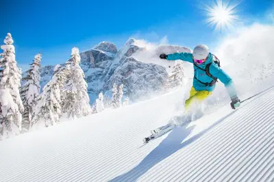 a person is skiing down a snow covered slope at Garden Apartment Untermühle in Bressanone