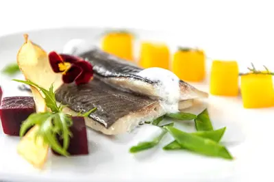 a plate of food with ice cream and desserts at Hotel Carmen Dolomites in Santa Cristina in Val Gardena