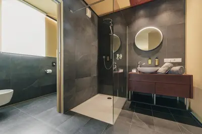 a bathroom with a sink and a shower at Apartments by Bemelmans-Post in Collalbo