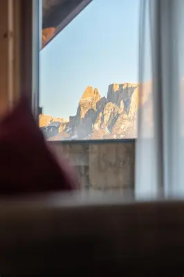 a view of a mountain from a window at Apartments by Bemelmans-Post in Collalbo