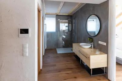 a bathroom with a sink and a mirror at Apartments by Bemelmans-Post in Collalbo