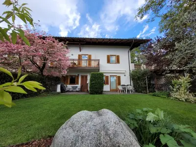 a house with a yard with a rock at Appartements Lena in Merano