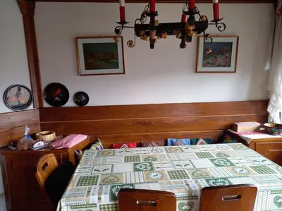 a bedroom with a bed with a quilt on it at Appartamento a San Vito di Cadore in San Vito di Cadore