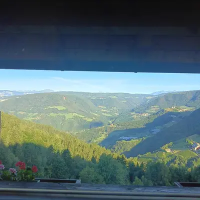 a view of a valley with a river and mountains at Waldnerhof in Soprabolzano